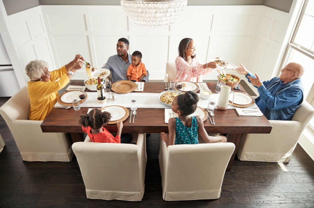Family having breakfast at the dining table | Wacky's Flooring